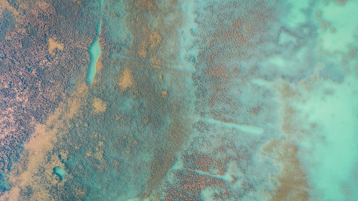 Aerial view of turquoise and copper coloured terrain