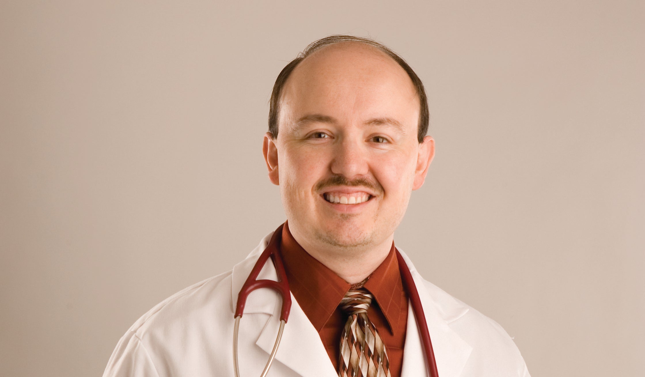 Practitioner in a white coat with a stethoscope