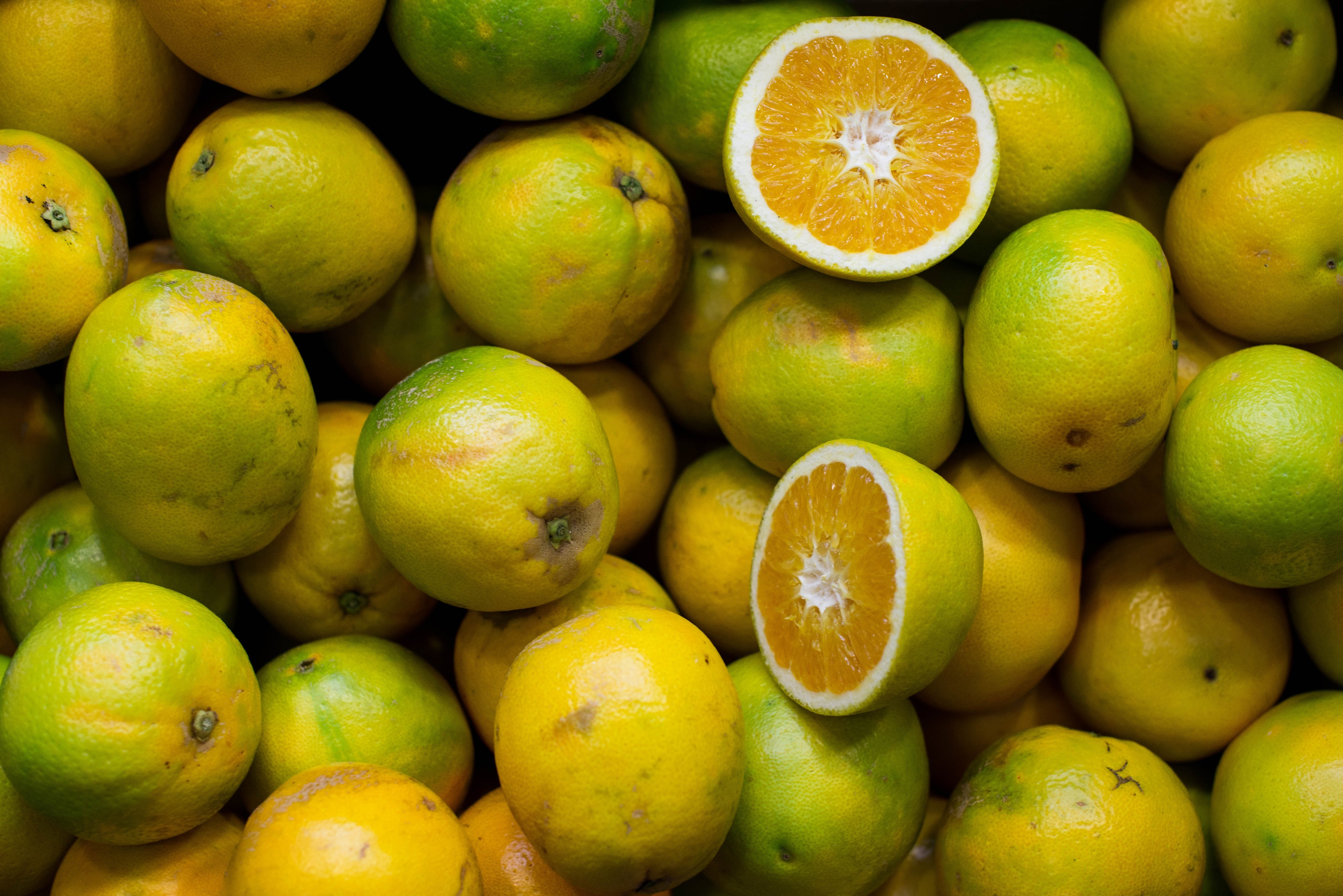 Oranges and lemons, one cut in half
