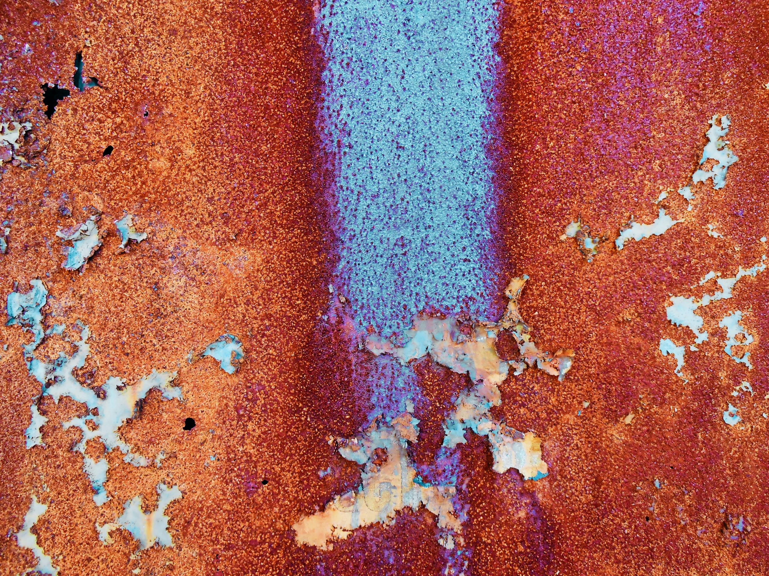 Aerial view of red and blue mineral terrain
