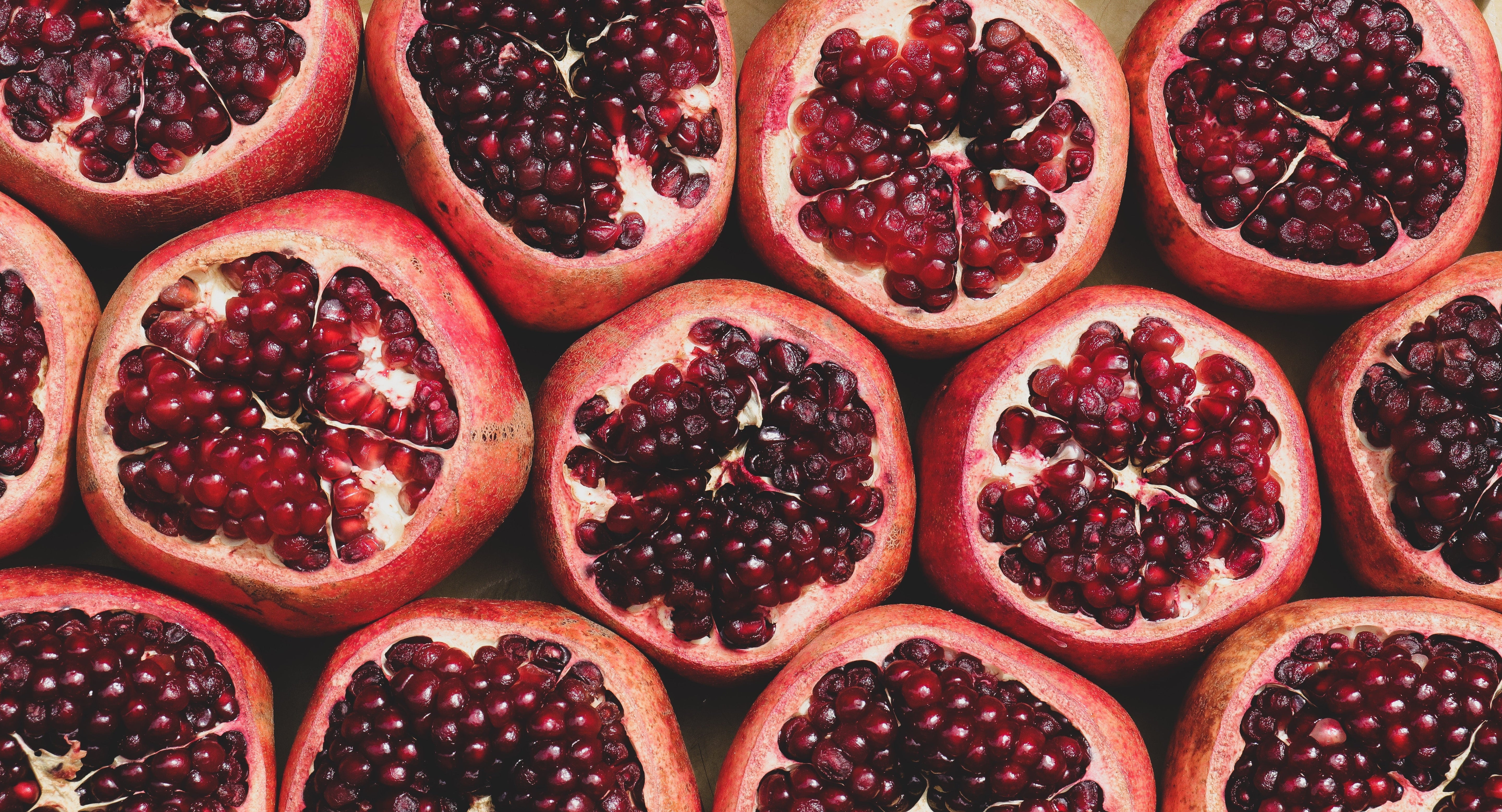 Halved pomegranates showing the seeds